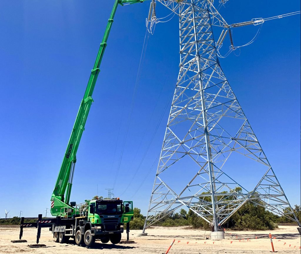 BOOM Logistics crane lifting a massive wind turbine blade for installation