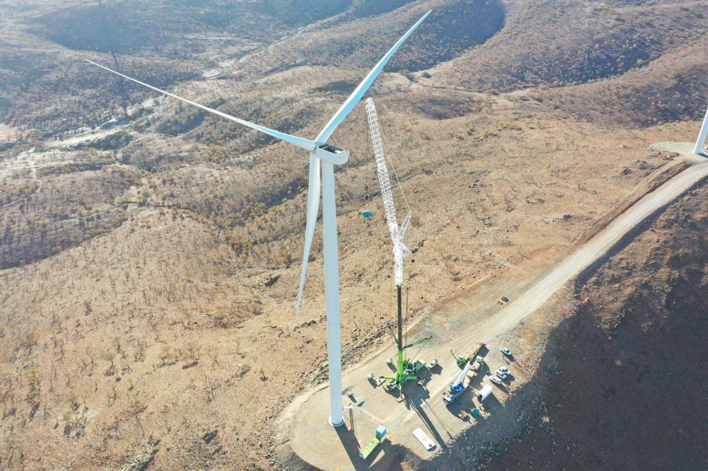 BOOM Logistics crane lifting and positioning a large generator