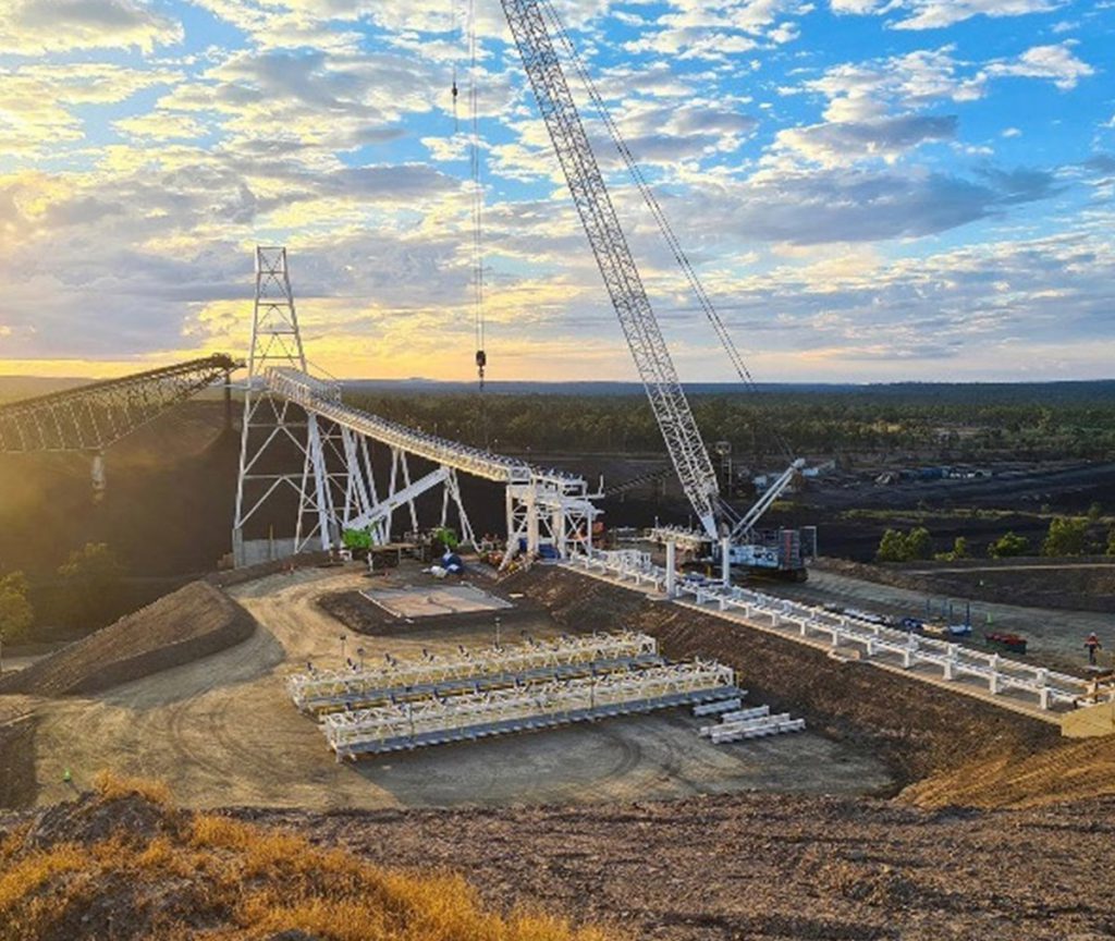 BOOM Logistics crane carefully lifting a large industrial tank